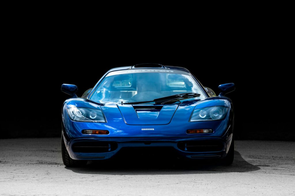 A blue sports car parked in a garage