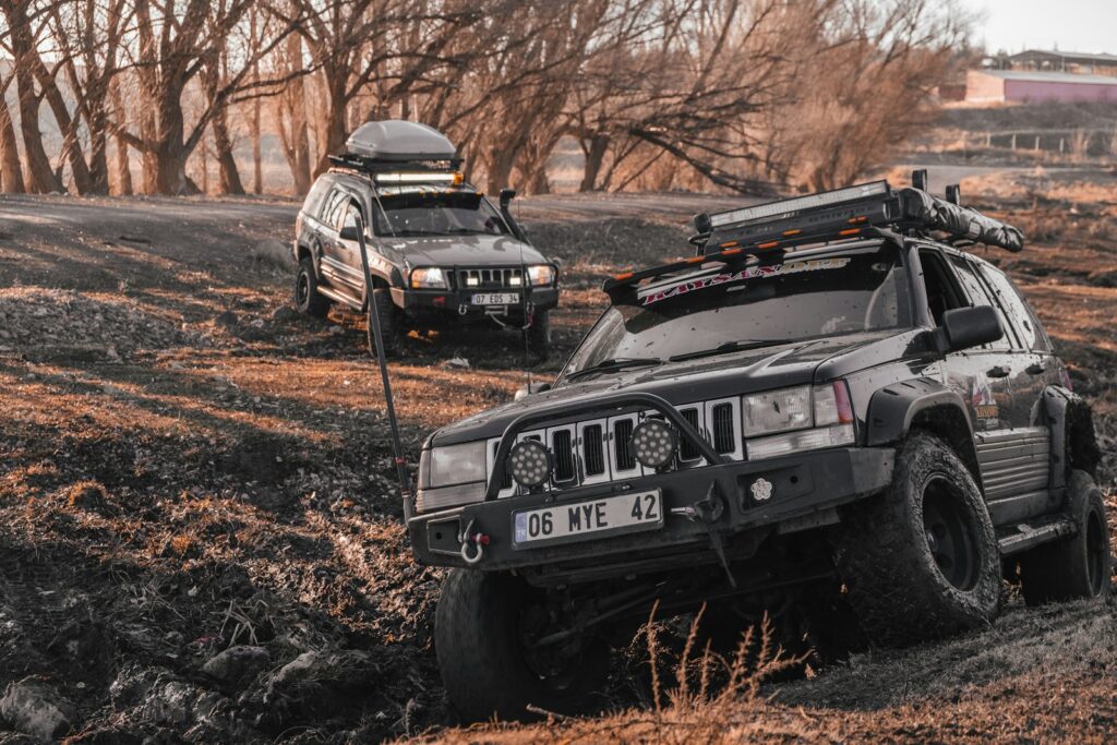 a couple of cars that are in the dirt