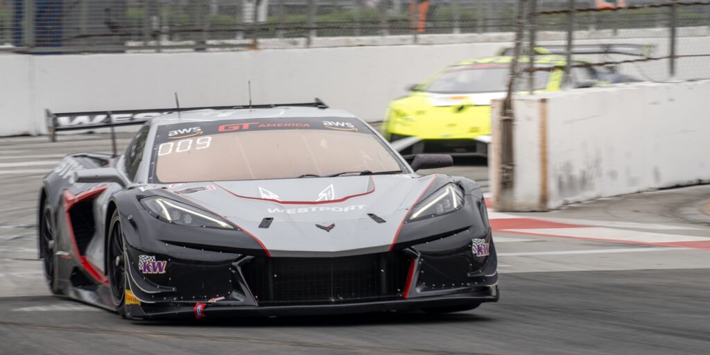 Race cars competing on a track during a race.