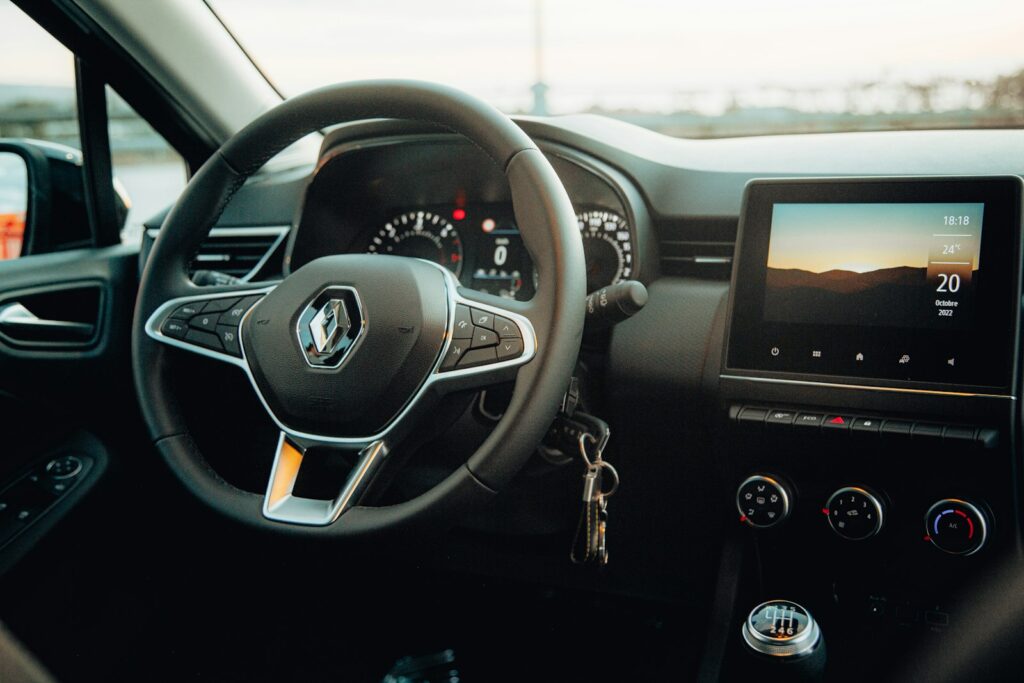 the steering wheel and dashboard of a car