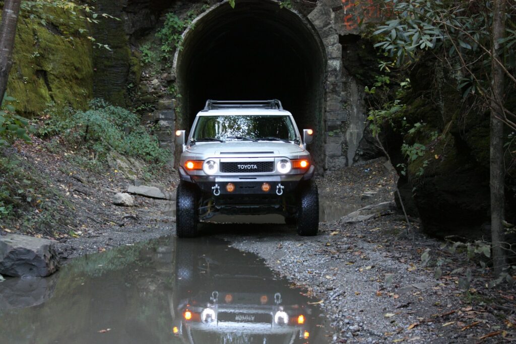 black suv in tunnel during daytime