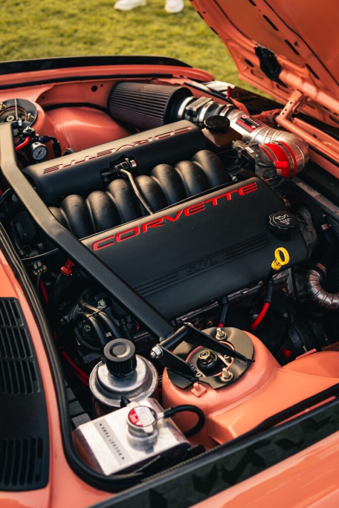 Close-up of a modified corvette engine in a car.