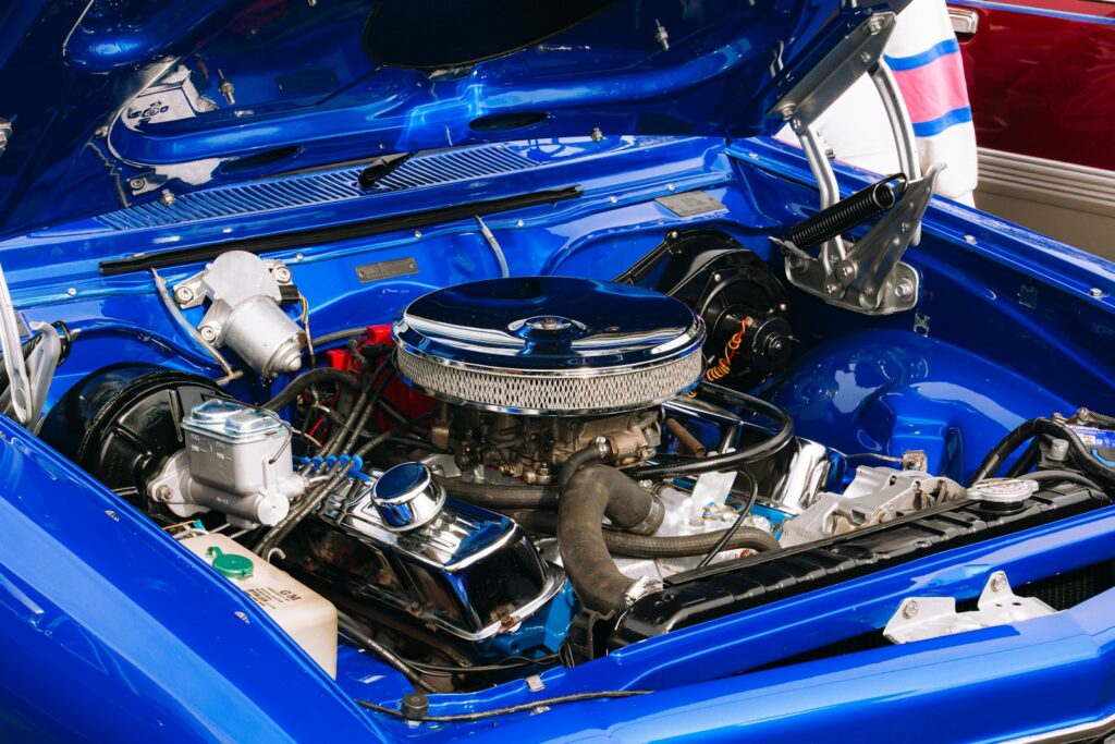 A close up of the engine of a blue car