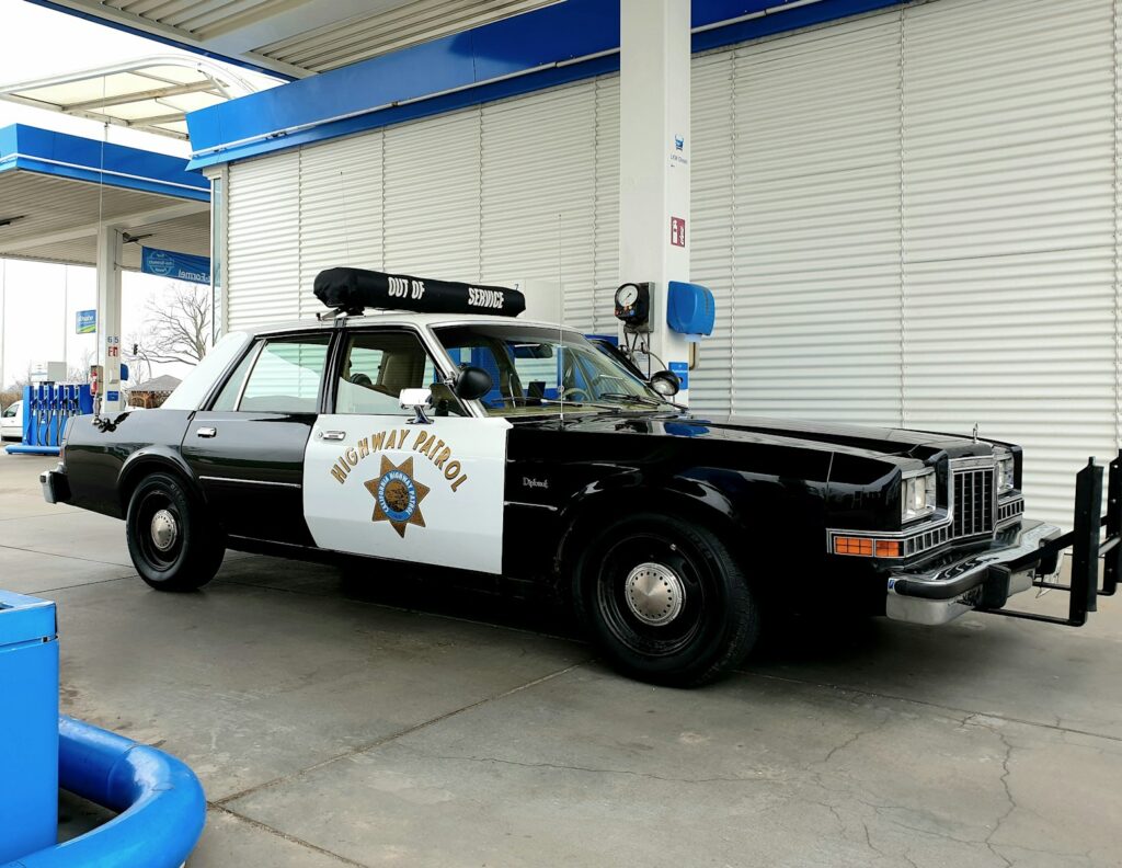 a police car parked in front of a building