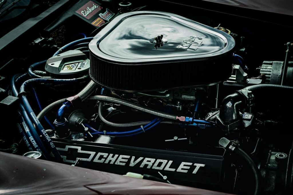 Detailed close-up of a Chevrolet engine showcasing performance parts and intricate mechanics.
