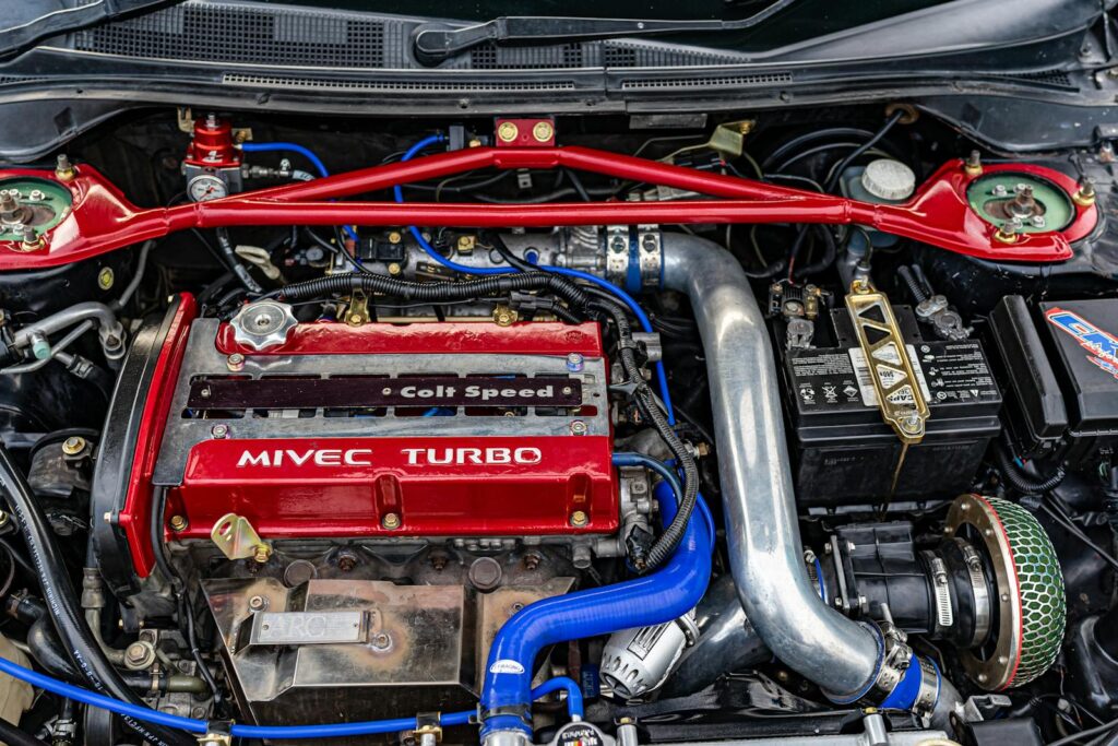 Close-up of a high-performance MIVEC turbo car engine showcasing technology and engineering.
