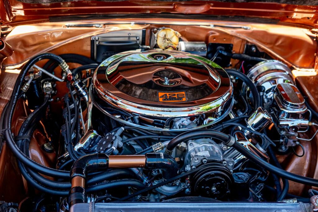 A detailed close-up shot of a vintage 426 Hemi engine, showcasing intricate automotive craftsmanship.