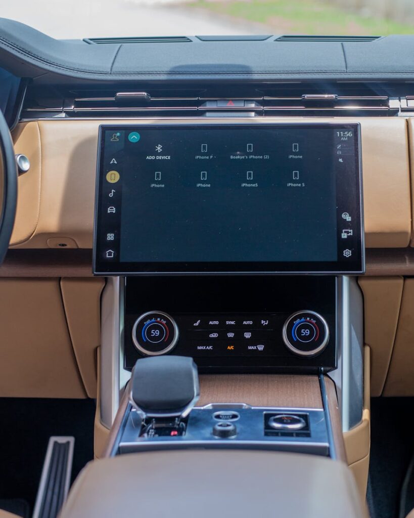 Modern interior of a luxury SUV showcasing a large touchscreen display with advanced features.