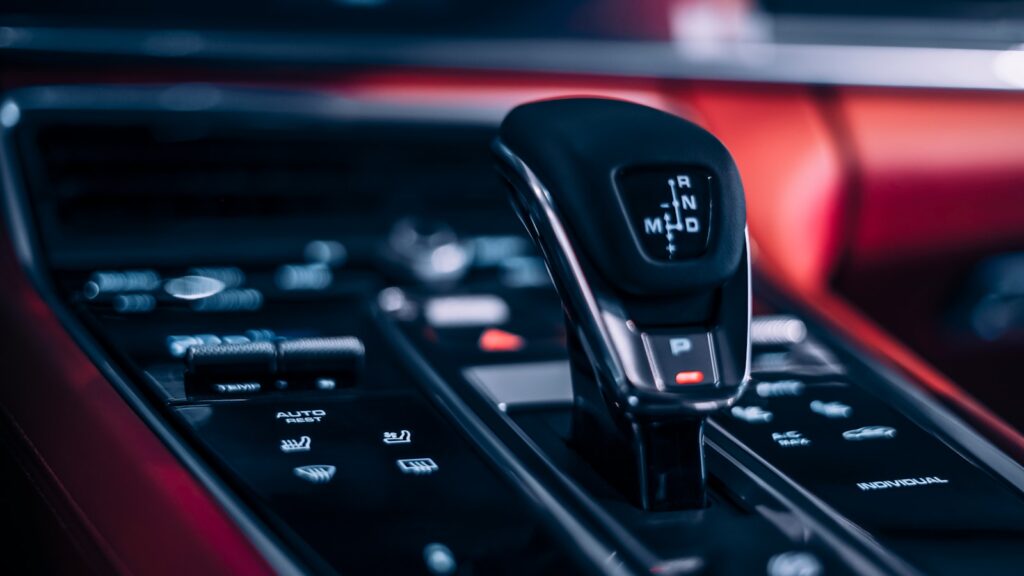 a black cell phone on a black dashboard