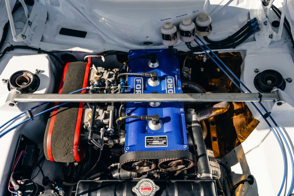 Ford engine bay with blue covers.