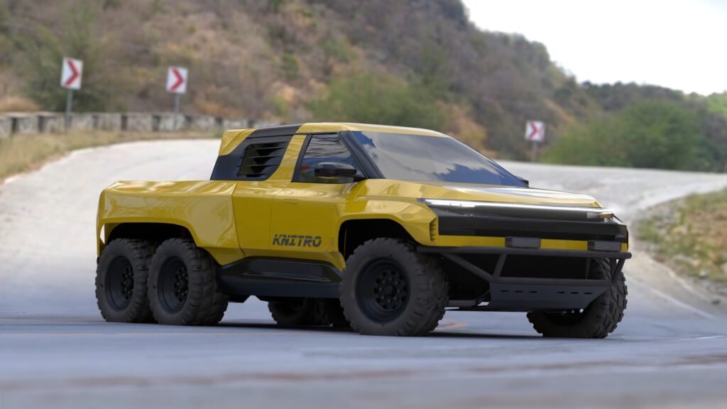 A yellow six-wheeled truck drives on a winding road.