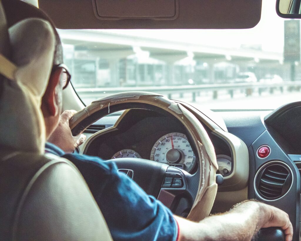 man driving car