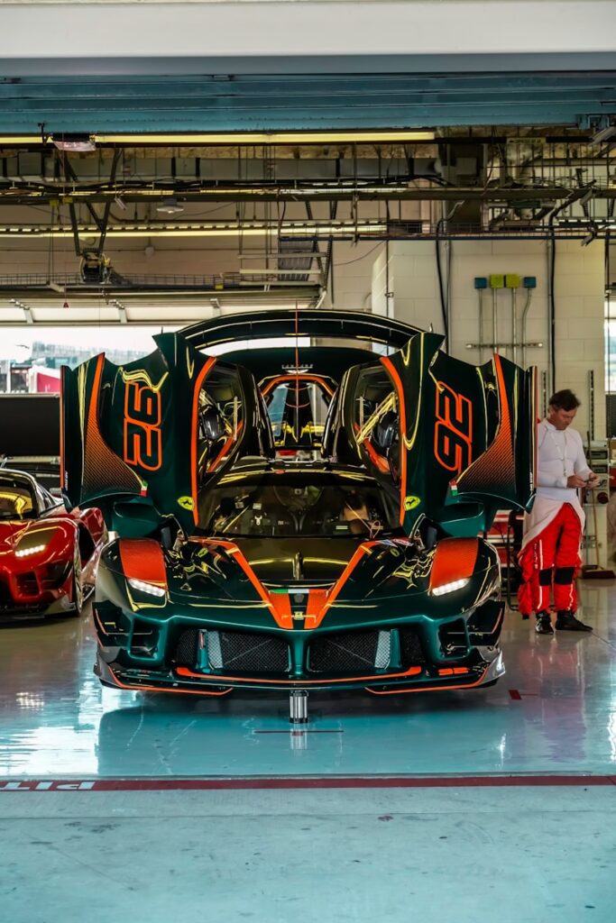 A group of men working on a car in a garage