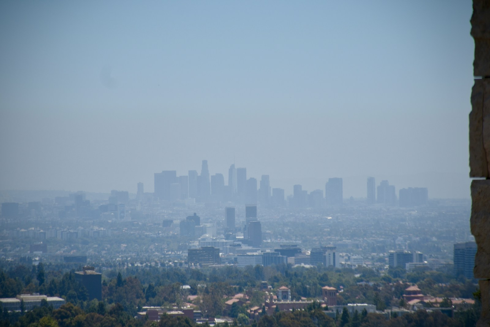 City skyline seen through hazy atmosphere on a clear day.