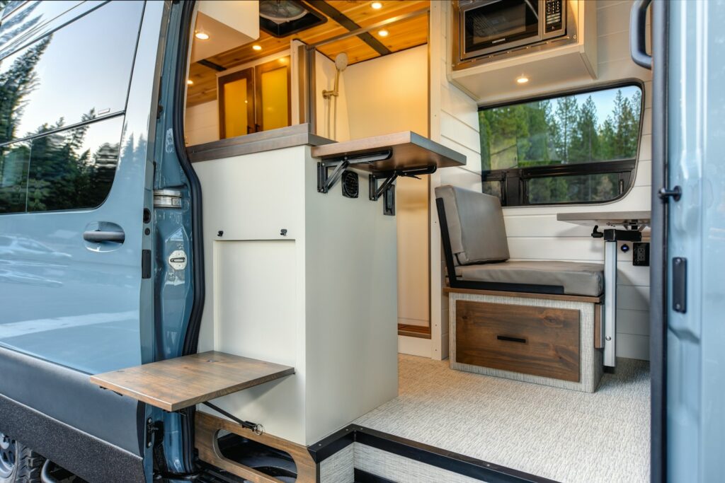 the interior of a camper van with the door open