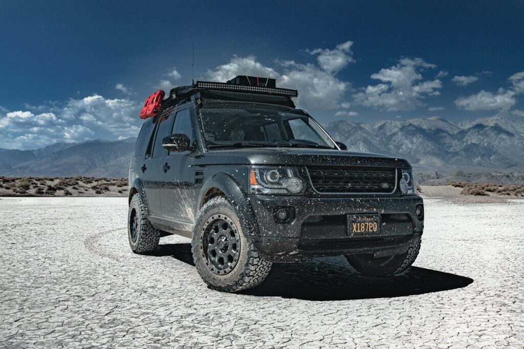 a car parked on a sandy area