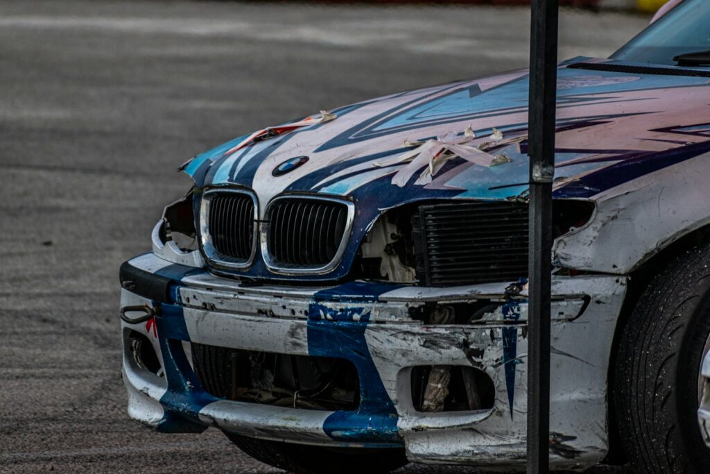 a blue car with a black grill