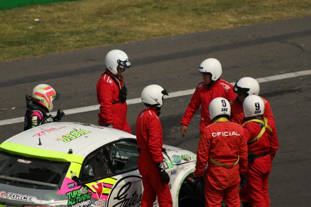 Race crew with driver after a race event in Ciudad de México, Mexico.