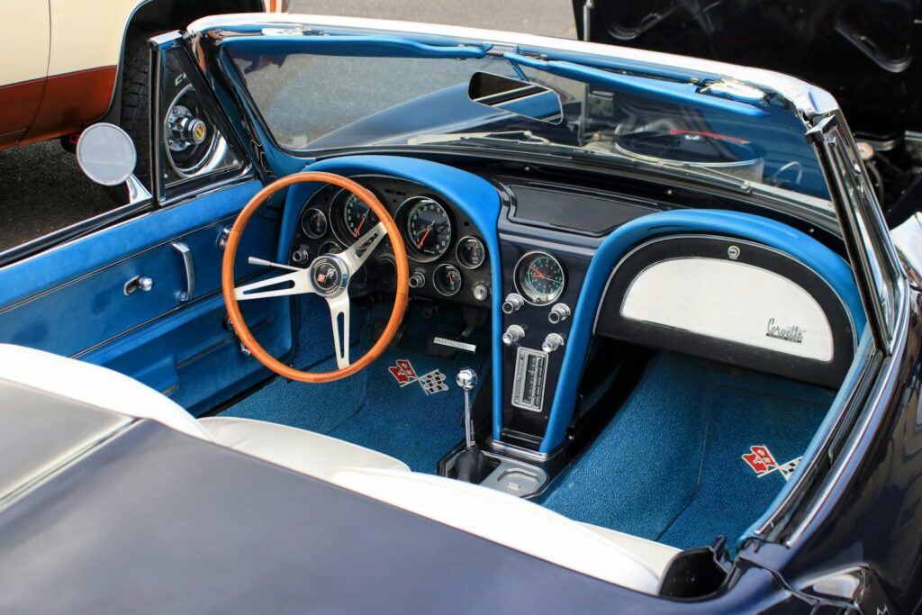 Explore the classic design of a vintage Corvette convertible interior with blue accents.