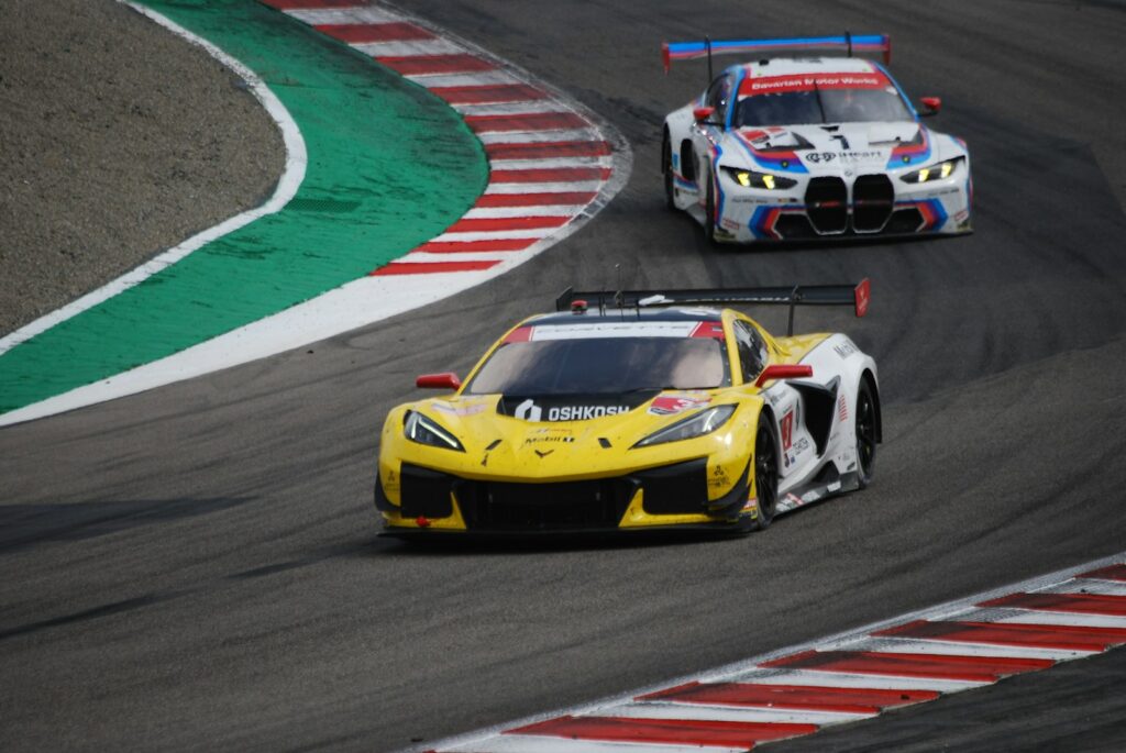 Two race cars speeding on a track