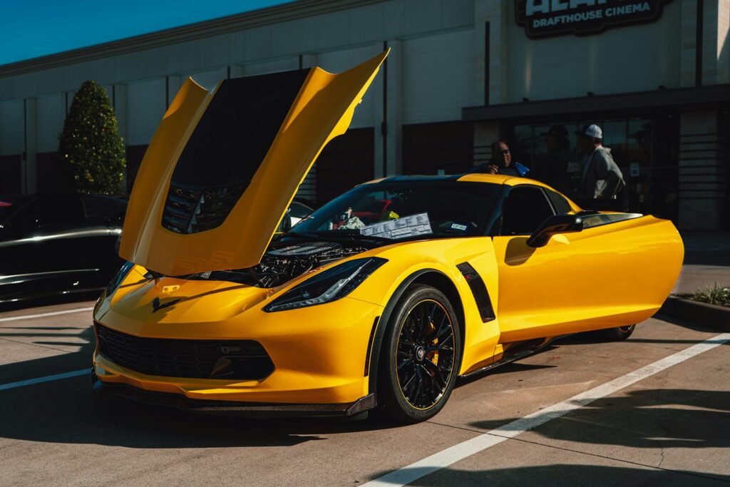 yellow ferrari 458 italia parked near white building