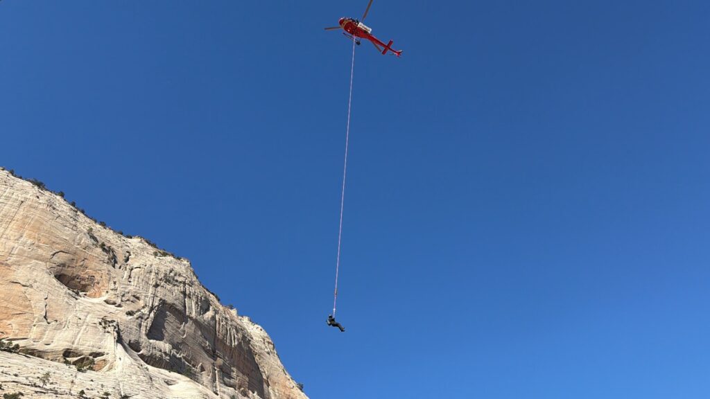 Helicopter rescues person from cliff face