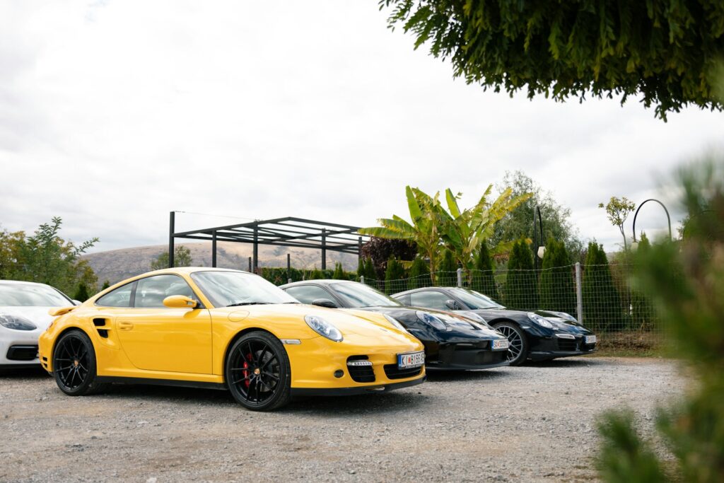 Several porsches parked in a lot