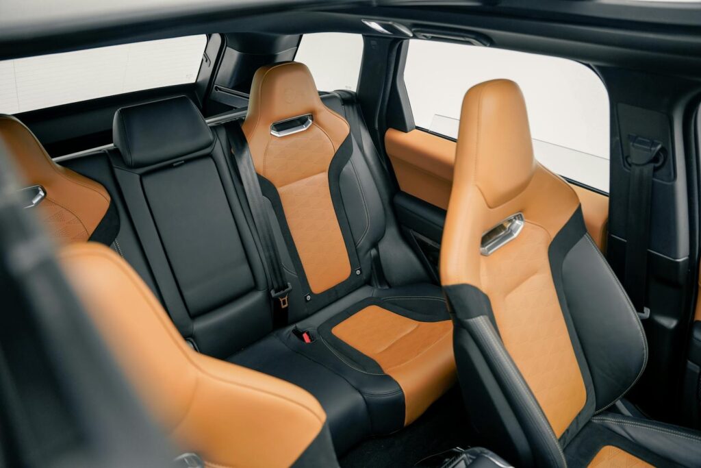 Elegant car interior featuring modern black and tan leather design for luxury travel.