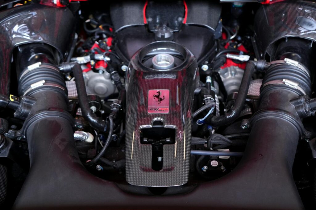 High-resolution image of a Ferrari engine showcasing complex mechanical components.
