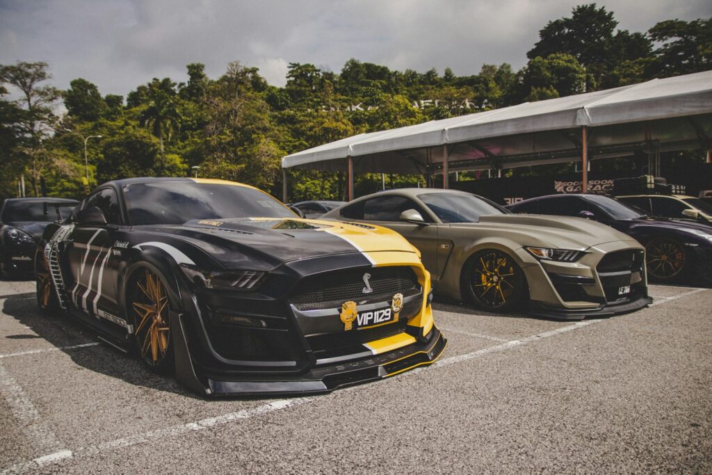 a group of cars parked next to each other in a parking lot