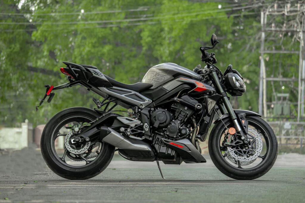 Side view of a sleek sports motorcycle parked on a street in India.