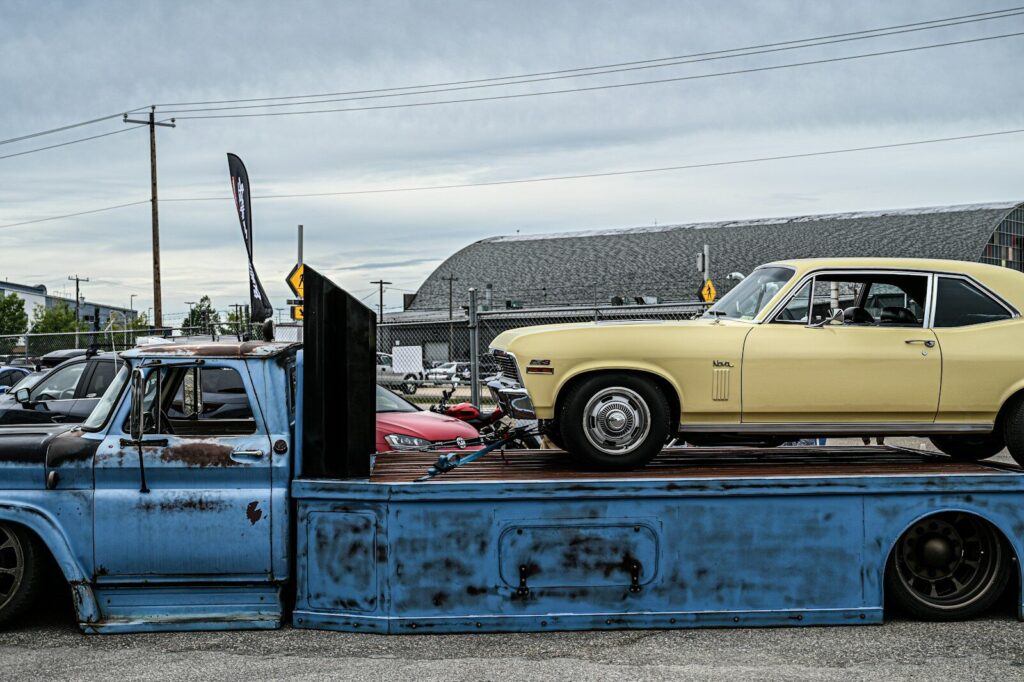 a truck is parked next to a car