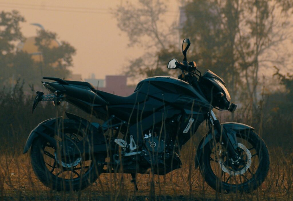 black motorcycle on brown field during daytime