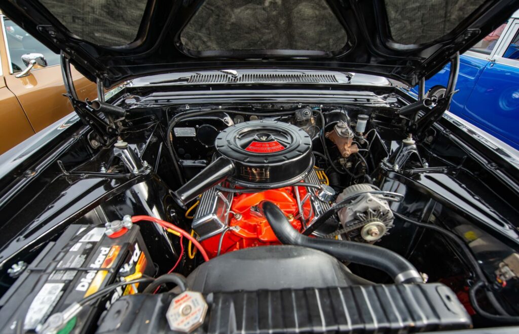 Detailed view of a vintage car engine highlighting its mechanics.