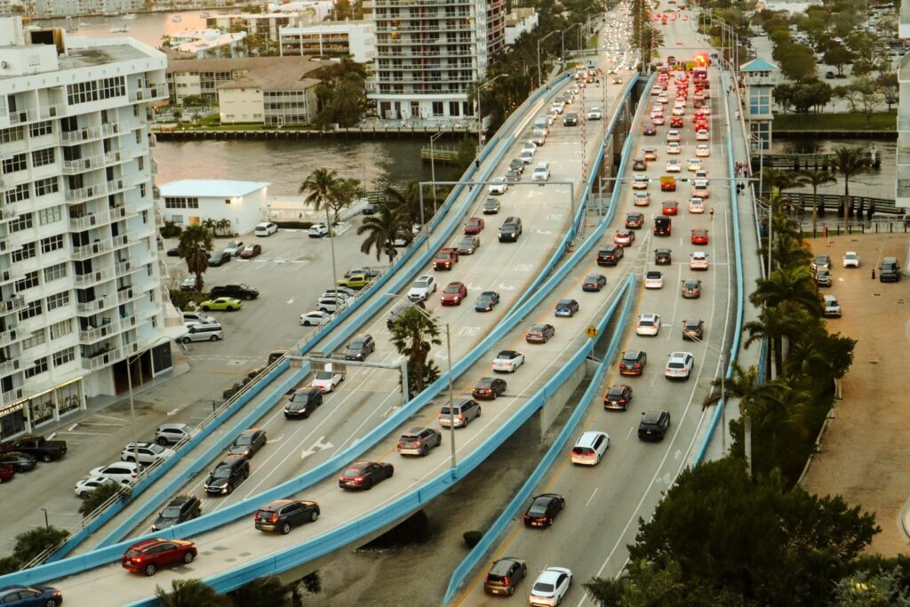 High angle view of urban traffic on a multi-lane road, showcasing city life and infrastructure.