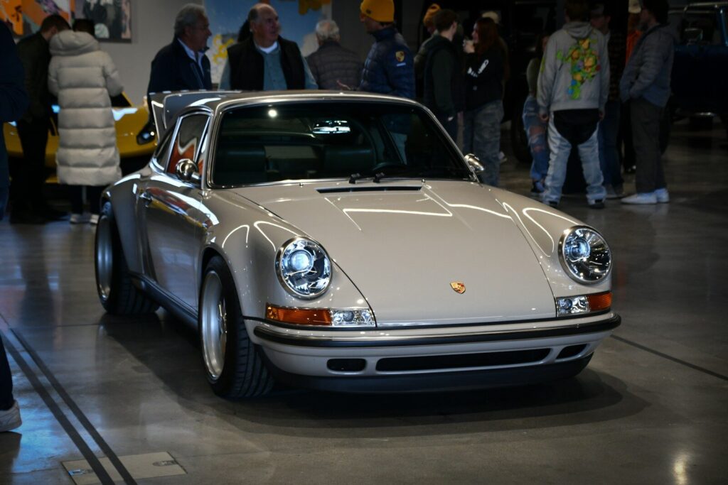 A classic porsche car is on display