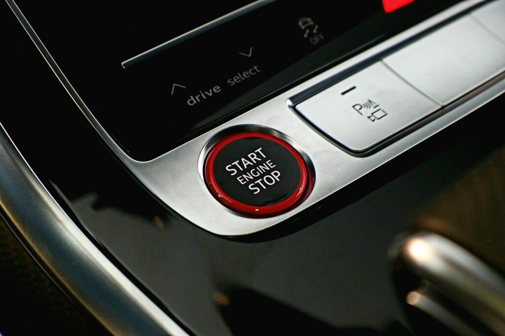 a close up of a button on a car radio