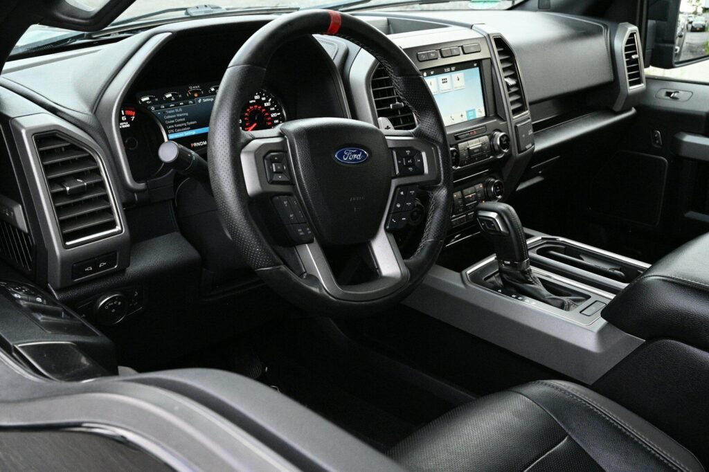 a close up of a car dashboard with a steering wheel