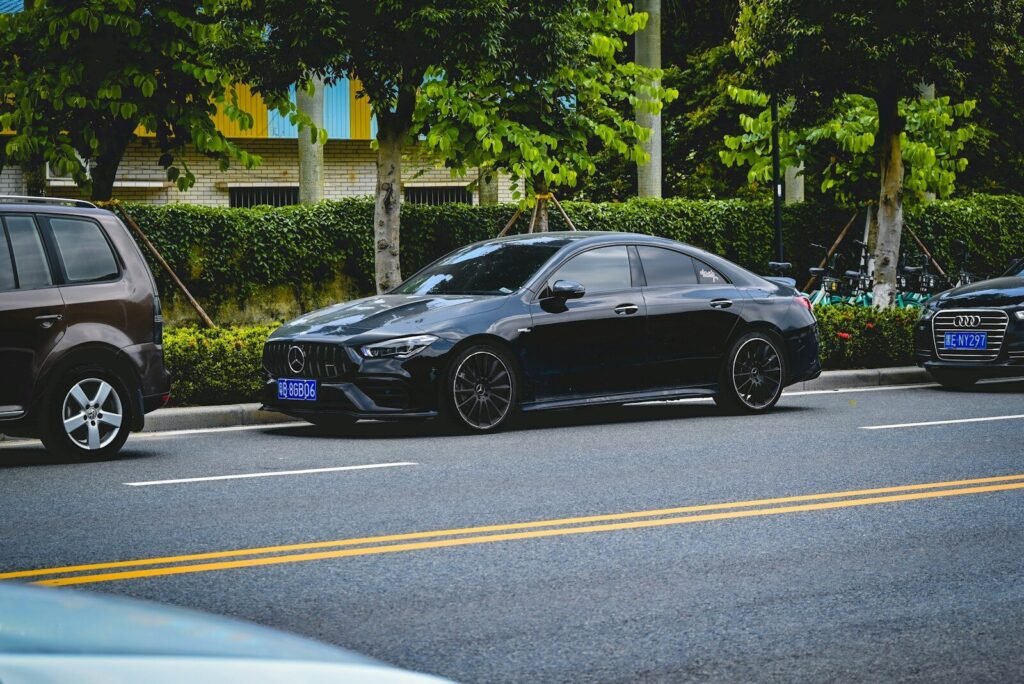 a couple of cars parked on the side of the road