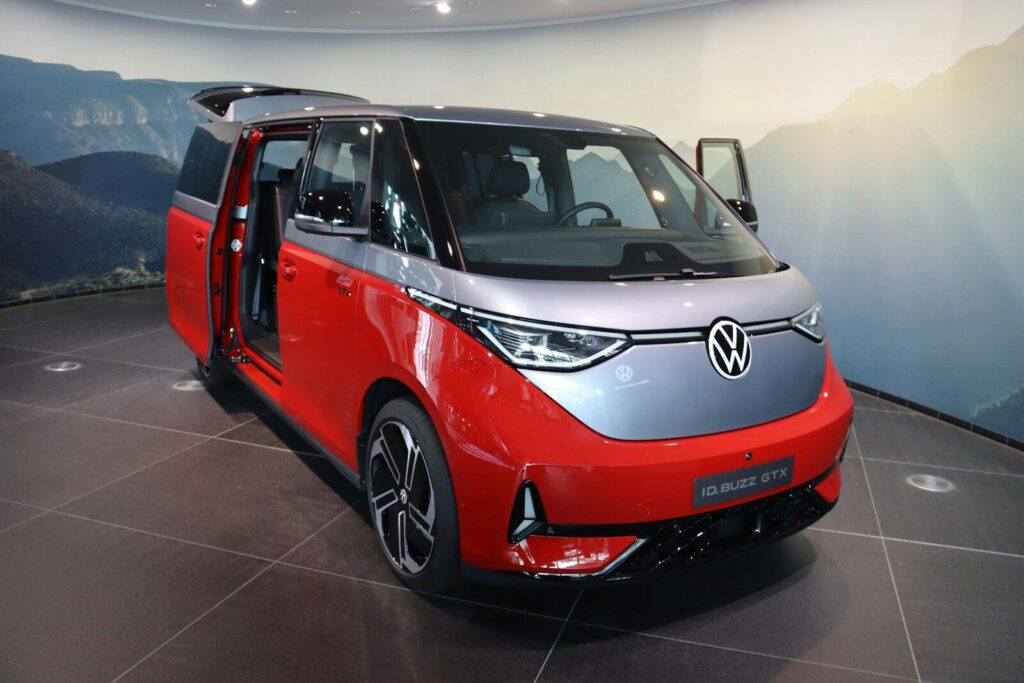 The red and silver volkswagen id. buzz minivan