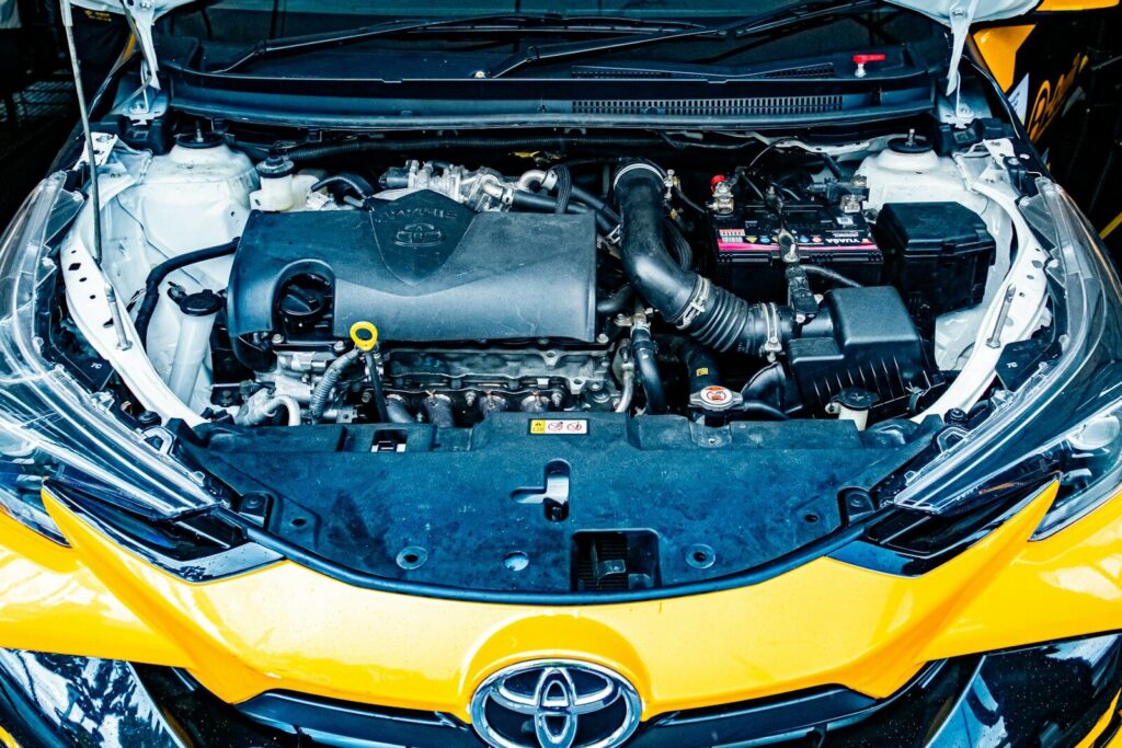 Open car hood revealing the engine