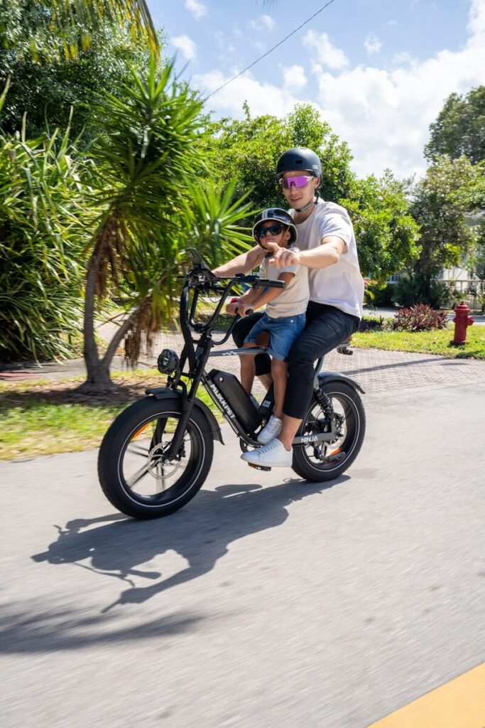 A man and a woman riding on the back of a motorcycle