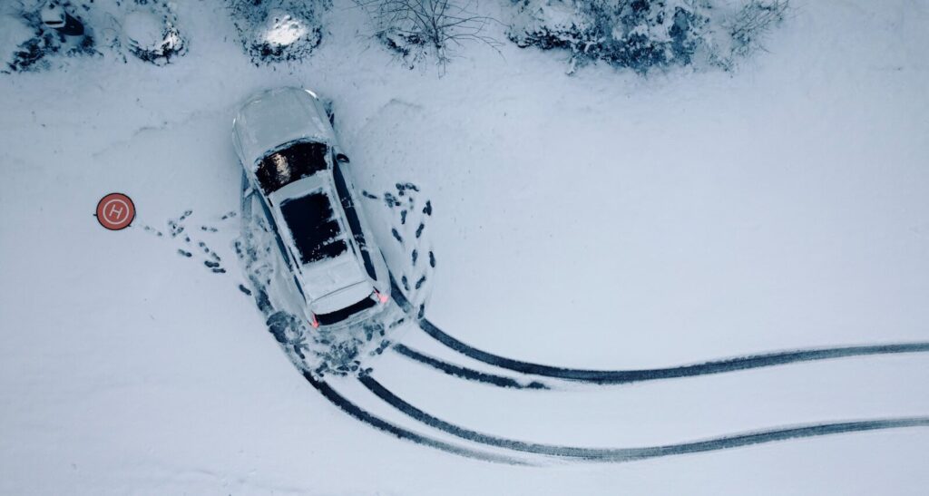 an aerial view of a car in the snow
