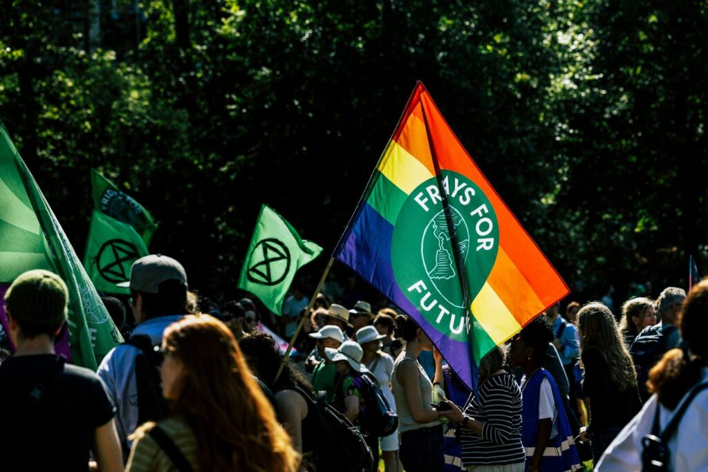 a group of people holding a rainbow flag