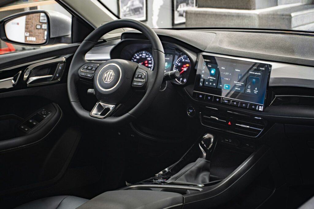 Modern car interior with digital dashboard and steering wheel