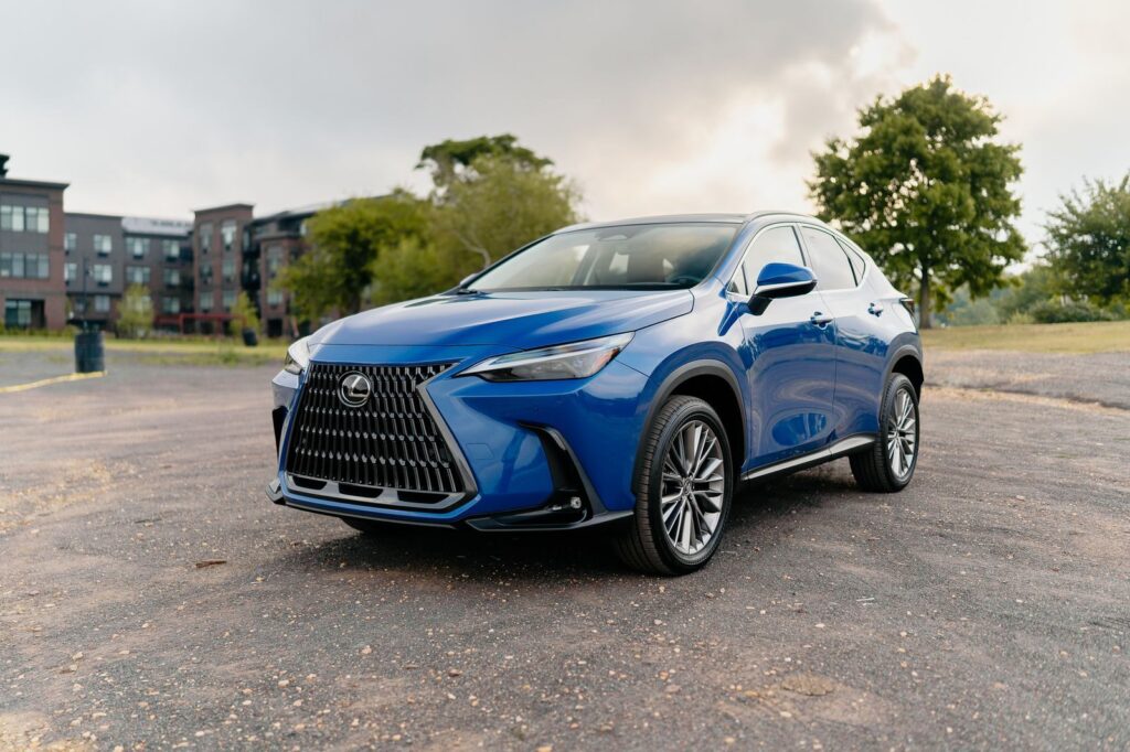 A stylish blue Lexus SUV parked in an outdoor urban area on a clear day.