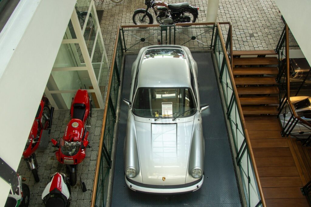 An overhead view of a car parked in a garage