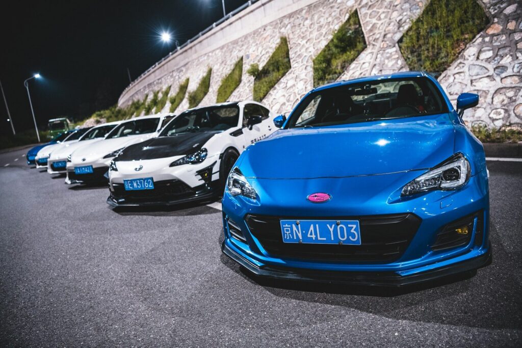 a group of cars parked on the side of a road
