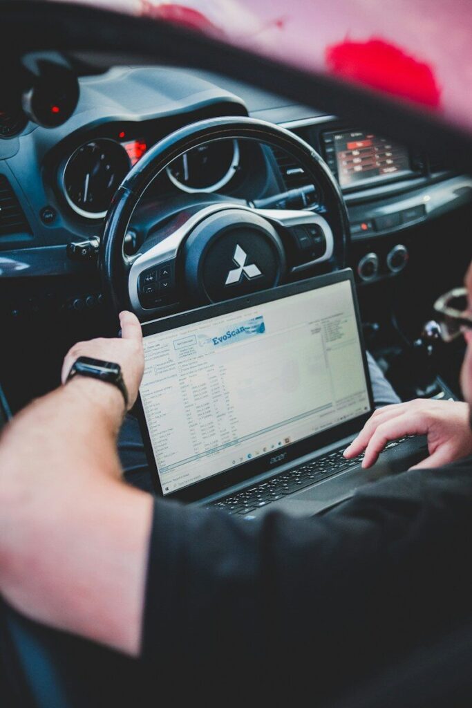 a person holding a laptop