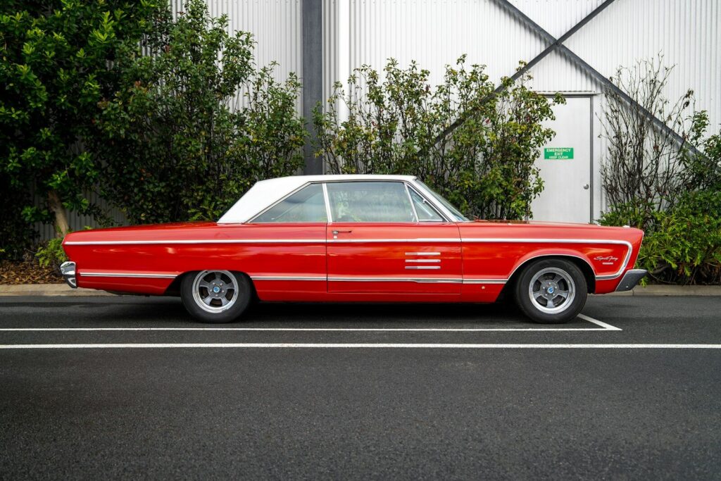 A classic red car is parked
